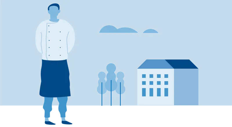 En person som står foran en bygning.